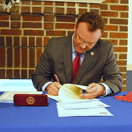 President Evans signing papers